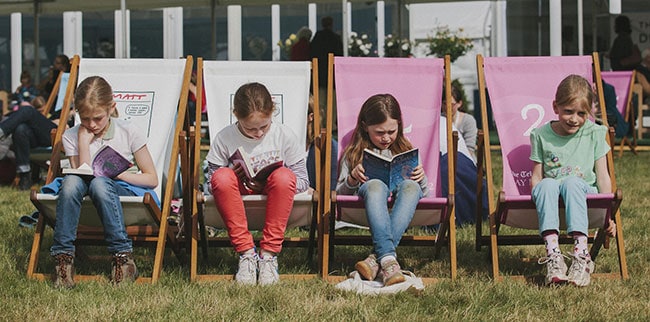 Children reading books at Hay Festival